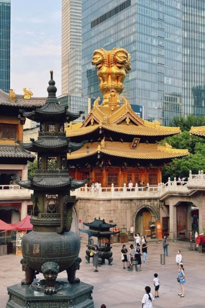 Visitors toss coins into the incense burner at Jing'an Temple.