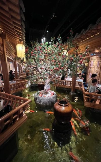 Inside Beiping Lou, there’s a small pond where tourists sit around enjoying traditional Beijing cuisine.