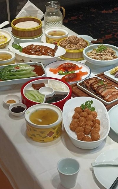 A table full of sumptuous Beijing dishes at Bianyifang Restaurant in Beijing.