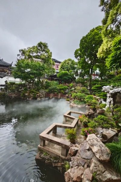 Yuyuan Garden has a ton of trees, and the lake has this mist around it, like something out of a fairy tale.