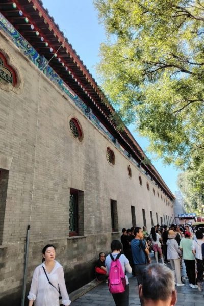 Visitors are exploring the rear pavilion of Prince Gong's Mansion.