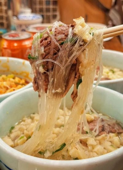 Lamb paomo is a standout Xi'an food, known for its delicious combination of tender lamb and pieces of flatbread immersed in flavorful soup.