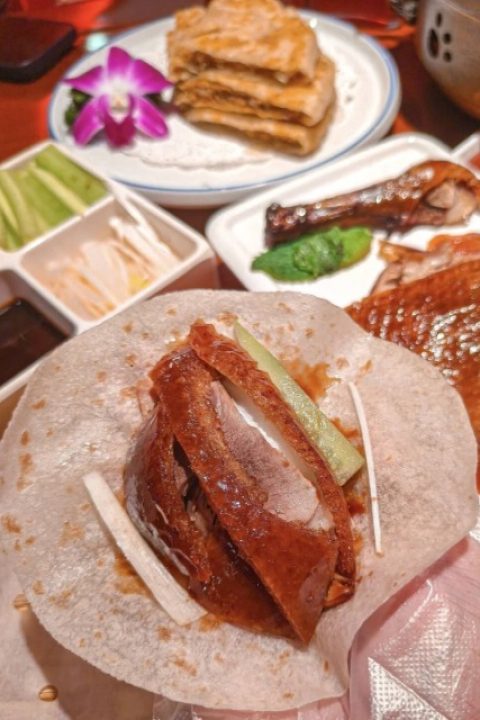 Thin pancakes wrapped around sliced Peking duck.