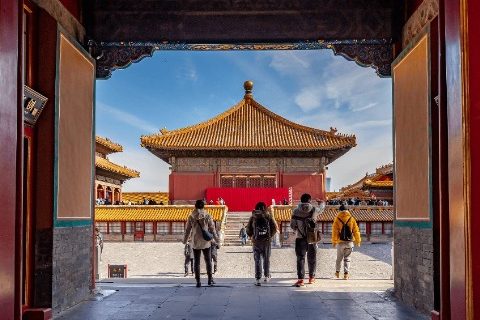 Visitors are entering the Forbidden City for a tour.