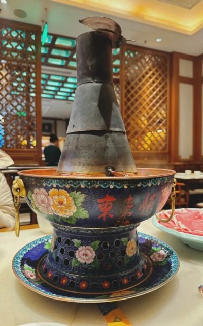 The copper pot with traditional Chinese patterns in Donglaishun Restaurant.