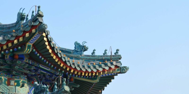 The blue eaves are adorned with many small statues of ancient Chinese mythical creatures.