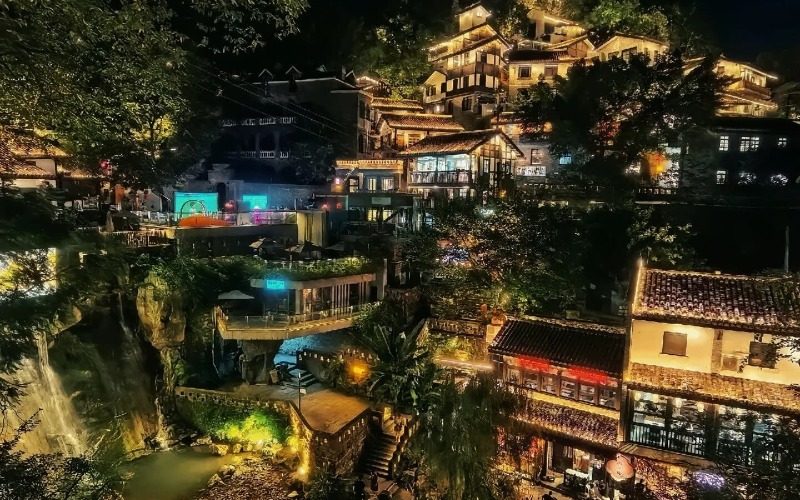 At night, the lights illuminate Xiahao Old Street in Chongqing.