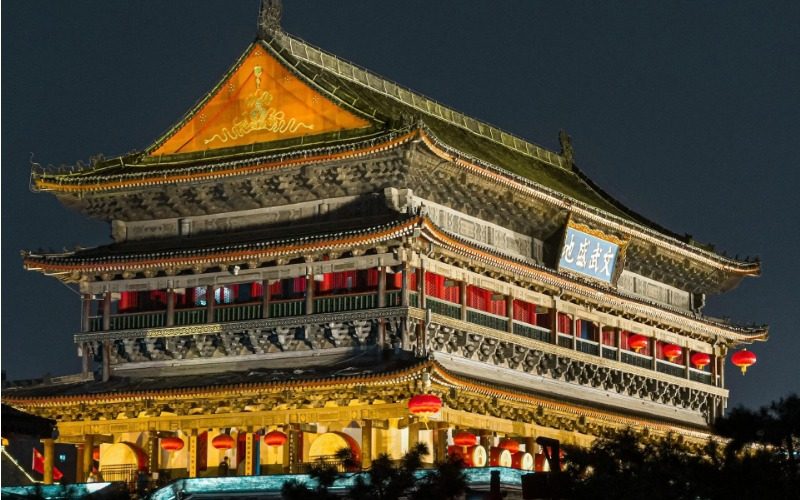 The Xi'an Drum Tower illuminated at night.