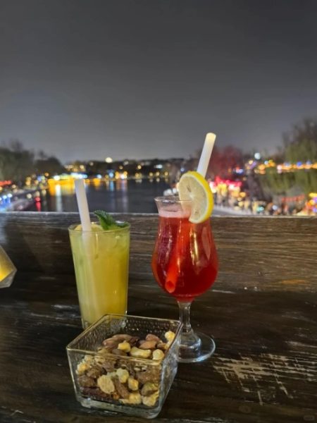 Tourists are enjoying cocktails by the lakeside at Houhai in Beijing.