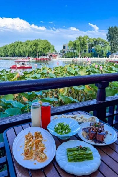 Having lunch by the lake covered in blooming lotus flowers.