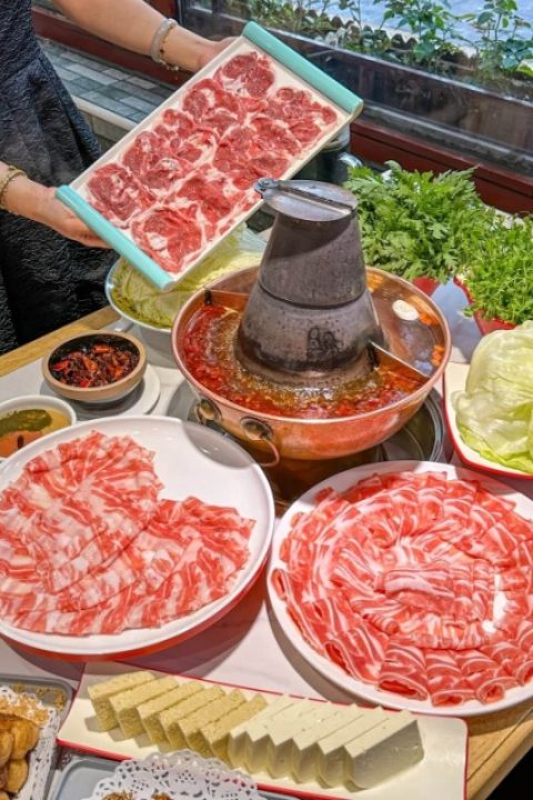 The old Beijing copper pot is surrounded by plenty of lamb.